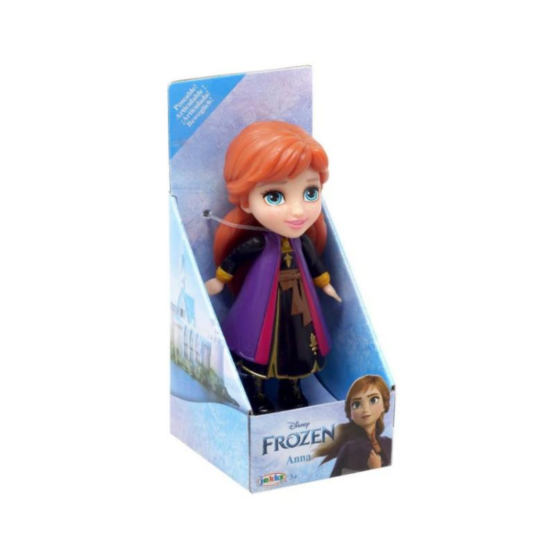 Disney Frozen Mini Toddler Doll of Princess Anna, featuring vibrant orange hair and a purple outfit in packaging.