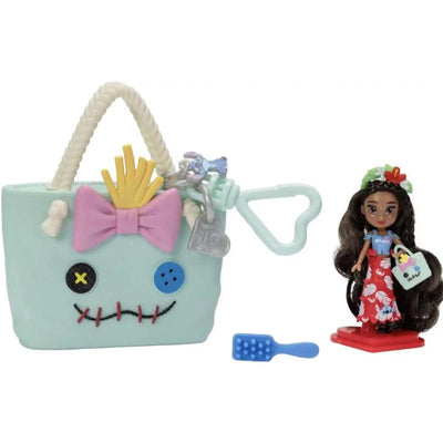 2-inch mini doll with long hair in a red floral dress, next to a creatively designed tote bag with a face and accessories.