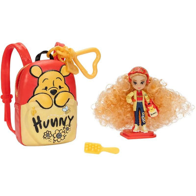 Winnie the Pooh-themed tote bag with a 2-inch mini doll featuring curly blonde hair, casual outfit, and honey-themed accessories.