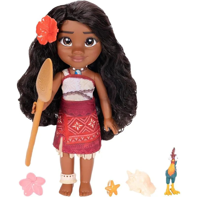 Large Moana doll with black hair and a flower, holding a wooden paddle, with accessories including a chicken and seashells.