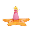 Princess Peach figurine from Jakks, dressed in a pink gown, standing on an orange star base, arms raised.
