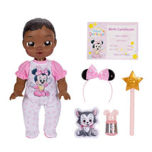 Minnie-inspired doll with dark brown hair and brown eyes, wearing a pink polka dot outfit, accompanied by accessories and a birth certificate.