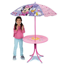 Minnie Mouse patio table with umbrella featuring colorful designs, alongside a smiling girl in a pink shirt.