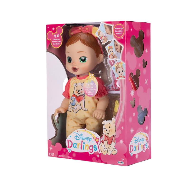 Interactive baby doll in Pooh-themed outfit, packaged with colorful design, suitable for nurturing play.