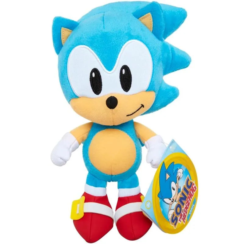 Blue plush toy of Sonic the Hedgehog, featuring a smiling face, white gloves, and red shoes, with a tag attached.