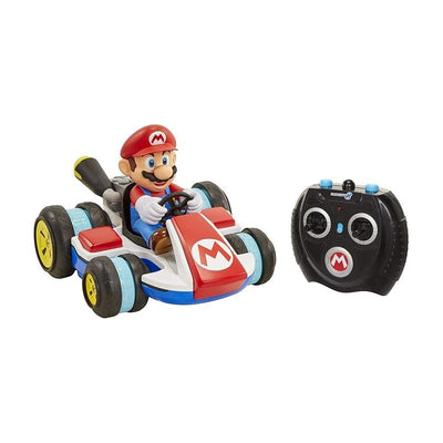 Mario character driving a mini remote-controlled kart in red and blue, with a black controller beside it.