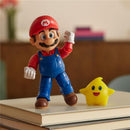 5” Mario action figure in blue overalls and red shirt, alongside a yellow glow-in-the-dark Luma star.