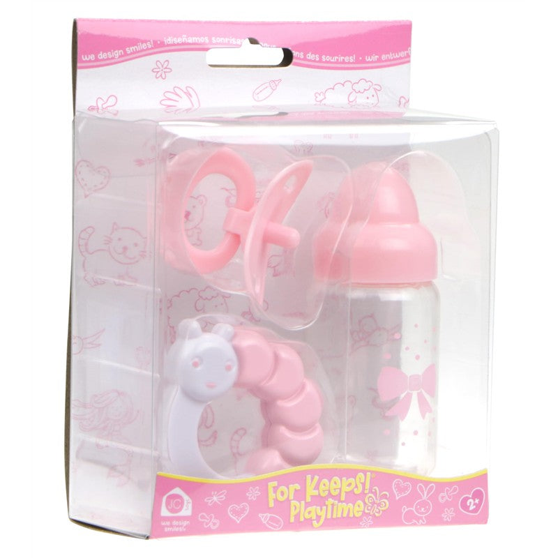JC Toys Pink Bottle and Rattle Set featuring a pink baby bottle, pacifier, and a caterpillar rattle, all encased in a clear package.