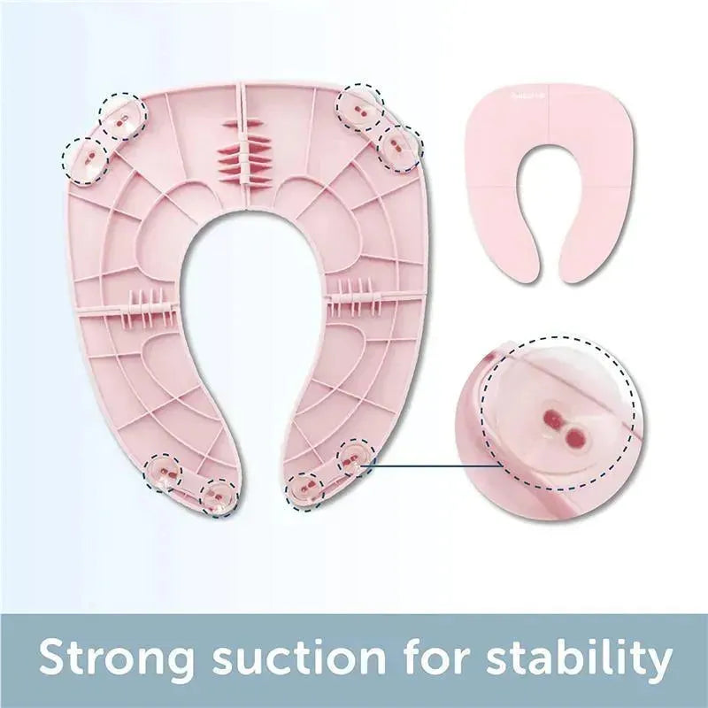Light pink folding travel potty seat with strong suction features, designed for stability during use.