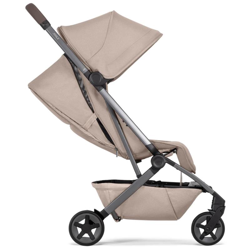 Lightweight compact stroller in Sandy Taupe color, featuring a sleek design, adjustable canopy, and sturdy wheels.
