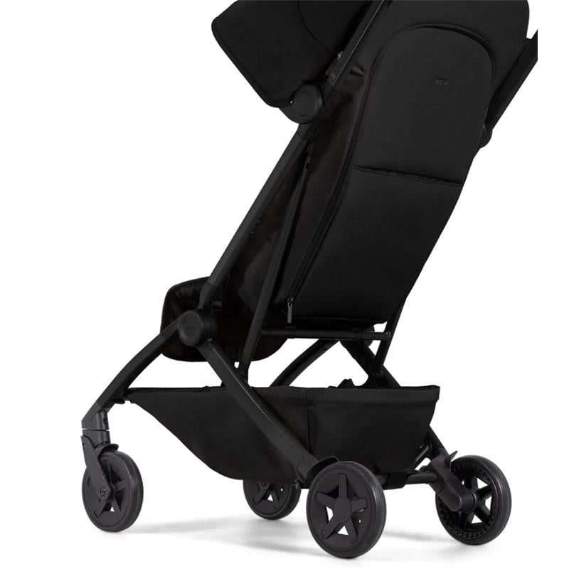 Lightweight compact stroller in Space Black, featuring a sleek design, adjustable seat, and star-patterned wheels.
