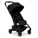 Lightweight compact stroller in Space Black, featuring a large canopy, padded seat, and storage basket.