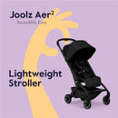 Joolz Aer² lightweight compact stroller in Space Black, featuring a sleek design with a canopy and comfortable seat, set against a pastel background.