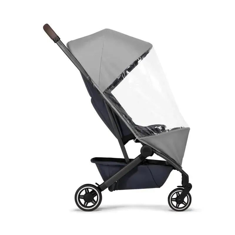 Joolz Aer+ Buggy Stroller Raincover with a transparent front and gray canopy, designed to protect the stroller from rain.