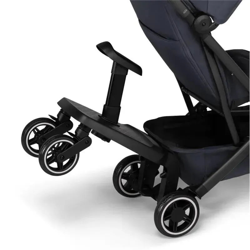 Black Joolz Aer+ footboard attachment for a stroller, featuring wheels for easy maneuverability and a handle for stability.