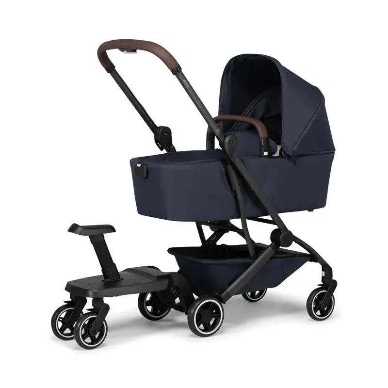 Joolz Aer+ stroller in dark blue with a footboard attachment and four wheels, designed for easy transport of infants.