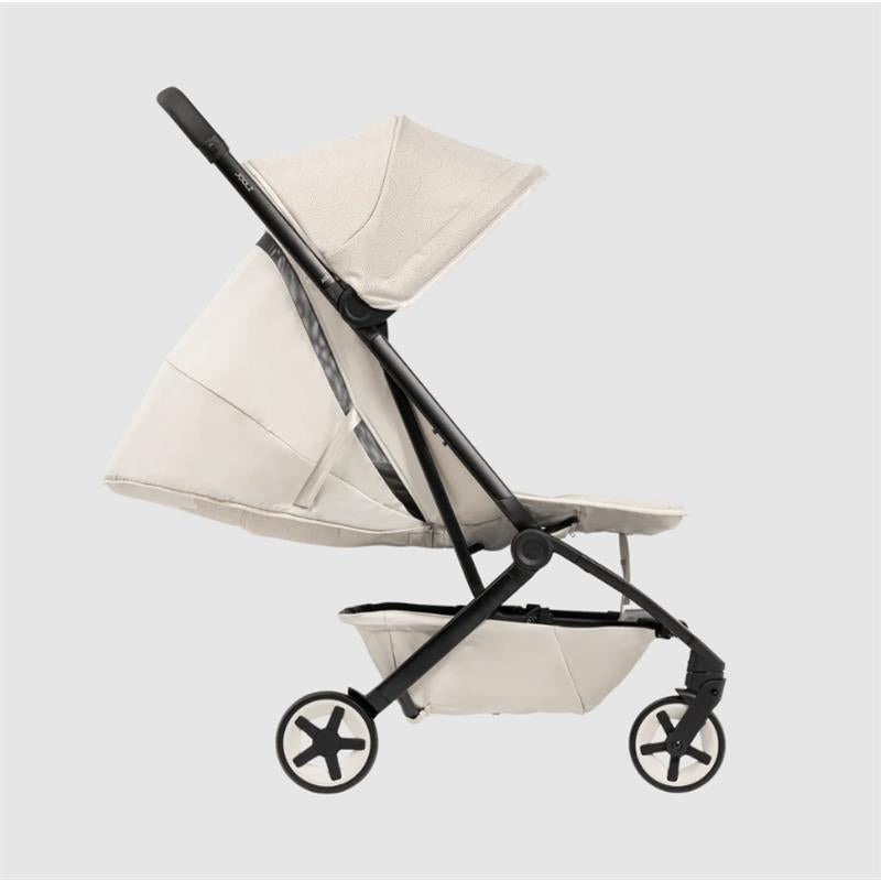 Lightweight compact Joolz Aer² stroller in calming beige, featuring a canopy and a black frame with star-shaped wheels.