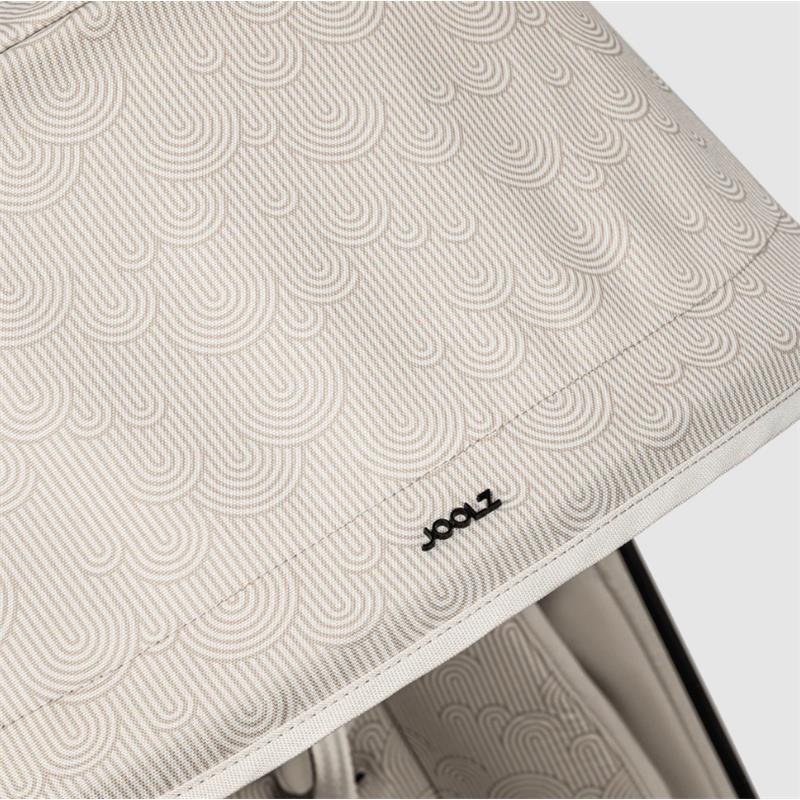 Light beige stroller canopy with a wavy pattern and black Joolz logo, part of the Aer² lightweight compact stroller.