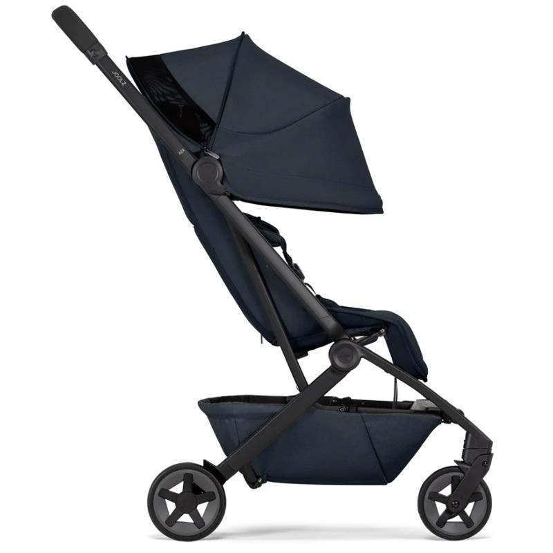 Joolz Aer² lightweight compact stroller in dark navy blue with a folded canopy, visible storage basket, and star-shaped wheels.