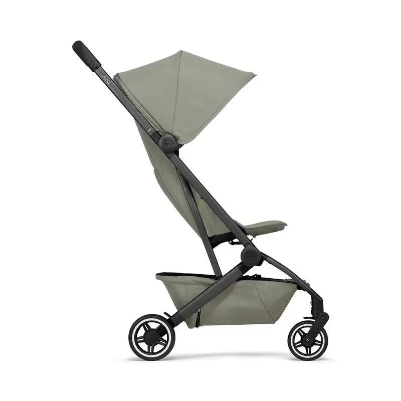 Lightweight Joolz Aer+ compact stroller in sage green, featuring a reclining seat and a large canopy.