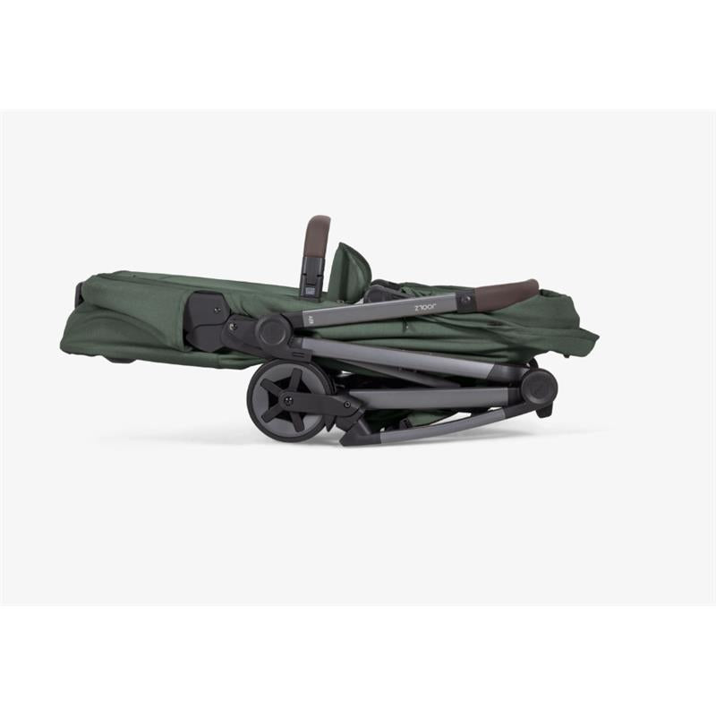 Folded Joolz Aer2 Bassinet in Forest Green, showcasing a compact design and sturdy wheels.