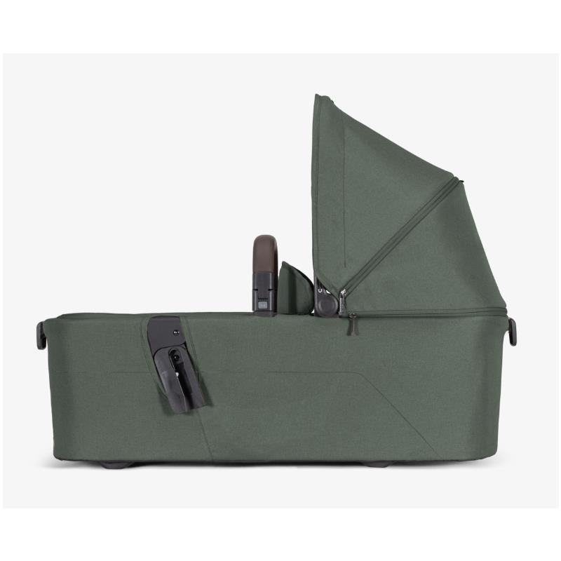 Joolz Aer2 Bassinet in Forest Green, featuring a zippered canopy and handle, designed for infants.
