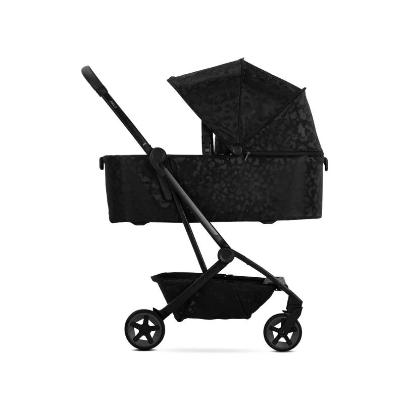 Joolz Aer2 Fold Cot in Space Black with a leopard print design and an adjustable canopy, showcasing a modern stroller style.