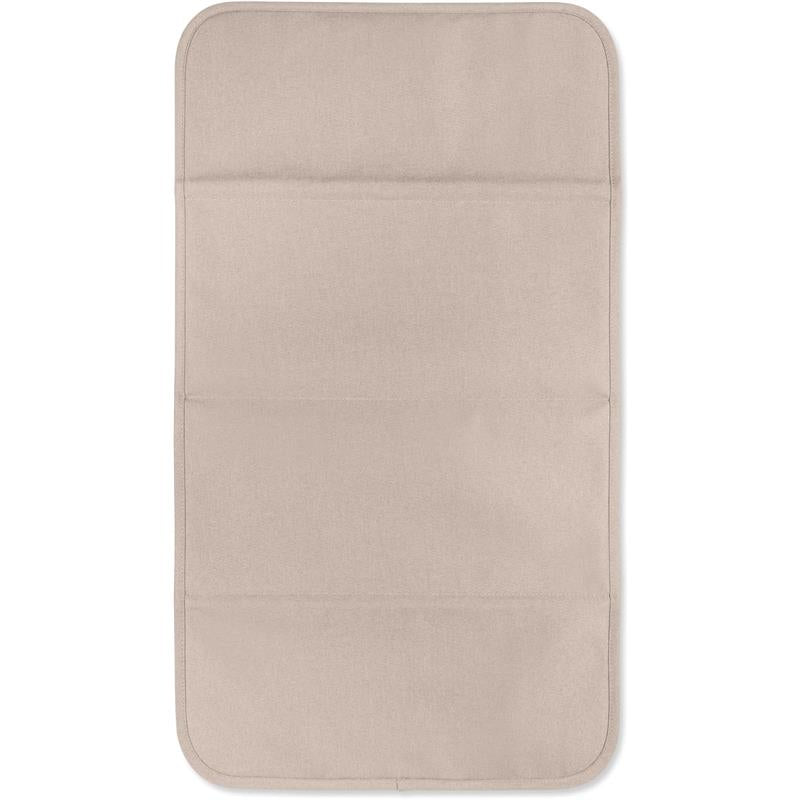Changing mat in sandy taupe color with rounded edges and three pockets for storage, designed for use with the Joolz Changing Backpack.