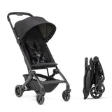 Joolz Dot ultra lightweight travel stroller in Space Black, displayed upright next to its compact folded form.