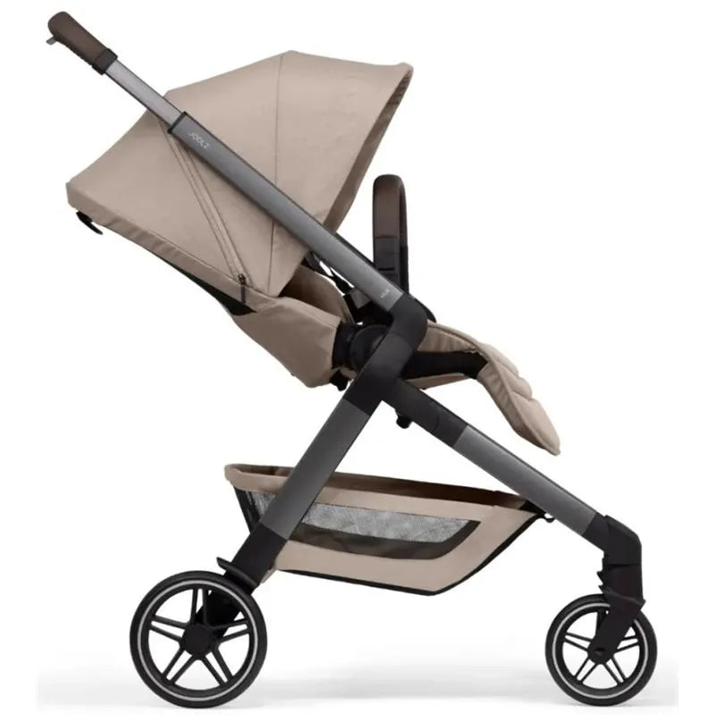 Lightweight Joolz Hub² Compact Stroller in Sandy Taupe with a canopy, adjustable seat, and mesh storage basket.