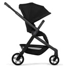 Compact Joolz Hub² stroller in space black, featuring a large canopy and a spacious storage basket.