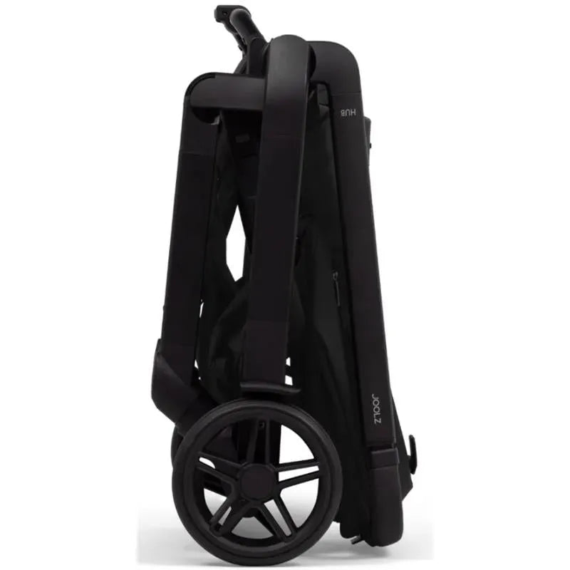 Joolz Hub² Compact Stroller in Space Black, folded with a sleek design and visible rear wheel.