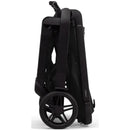 Joolz Hub² Compact Stroller in Space Black, folded with a sleek design and visible rear wheel.