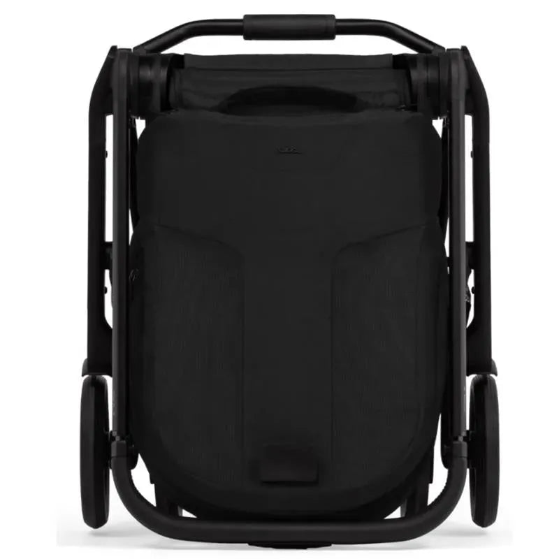Compact Joolz Hub² stroller in Space Black, viewed from the front in a folded position, showcasing a sleek design.