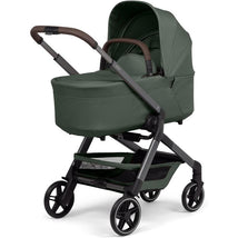 Joolz Hub2 Cot in Forest Green with a smart, sleek design and a comfortable canopy for infants.