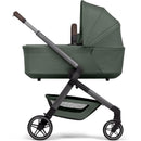 Joolz Hub2 Cot in Forest Green, featuring a sleek design with a removable cot, adjustable handlebar, and spacious underbasket.