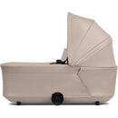 Joolz Hub2 Cot in Sandy Taupe, showcasing a sleek design with a raised canopy and a harness system.
