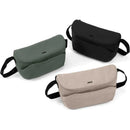 Joolz Organiser Space in black, green, and beige; a stylish bag with front pockets designed for convenient storage.