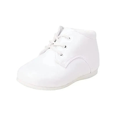 White baby boy dress shoes with lace-up straps, designed for christenings and formal occasions.