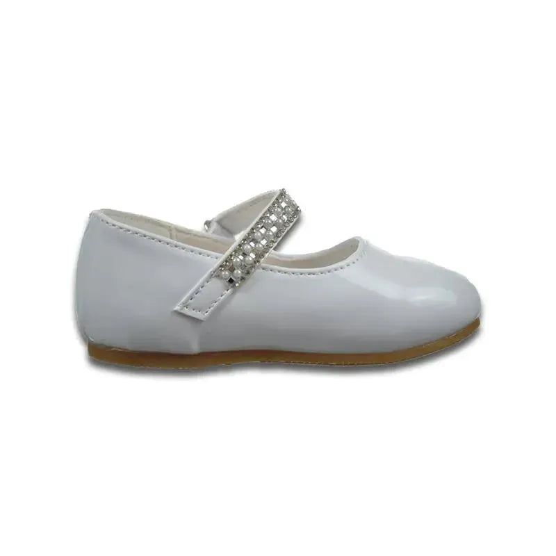 White baby girl christening shoe with a rounded toe and a decorative strap featuring rhinestones.