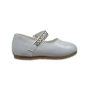 White baby girl christening shoe with a rounded toe and a decorative strap featuring rhinestones.