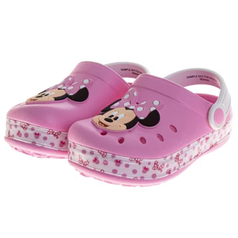 Slip-on clogs for girls featuring a Minnie Mouse design with a pink body and white polka dot accents.