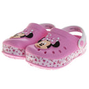 Slip-on clogs for girls featuring a Minnie Mouse design with a pink body and white polka dot accents.