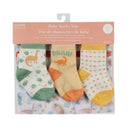 Baby socks trio featuring three pairs in pastel colors and dinosaur designs, packaged with a reusable mesh wash bag.