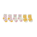 Three pairs of baby socks in pastel colors: pink with flowers, white with floral design, and yellow with daisies.