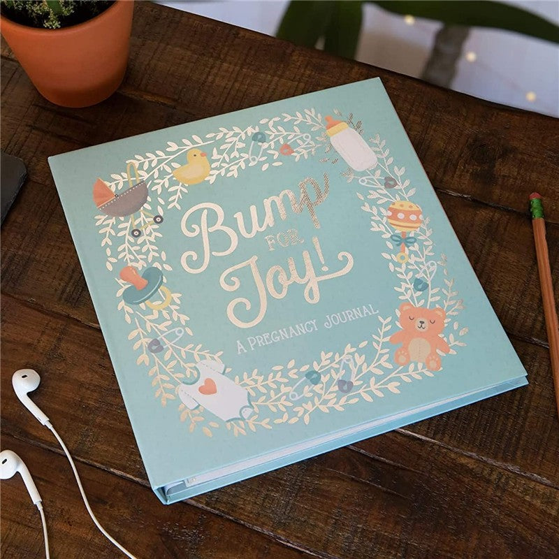 JuJuBe Bump For Joy! A Pregnancy Journal in green with whimsical illustrations and the title prominently displayed on the cover.