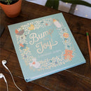 JuJuBe Bump For Joy! A Pregnancy Journal in green with whimsical illustrations and the title prominently displayed on the cover.