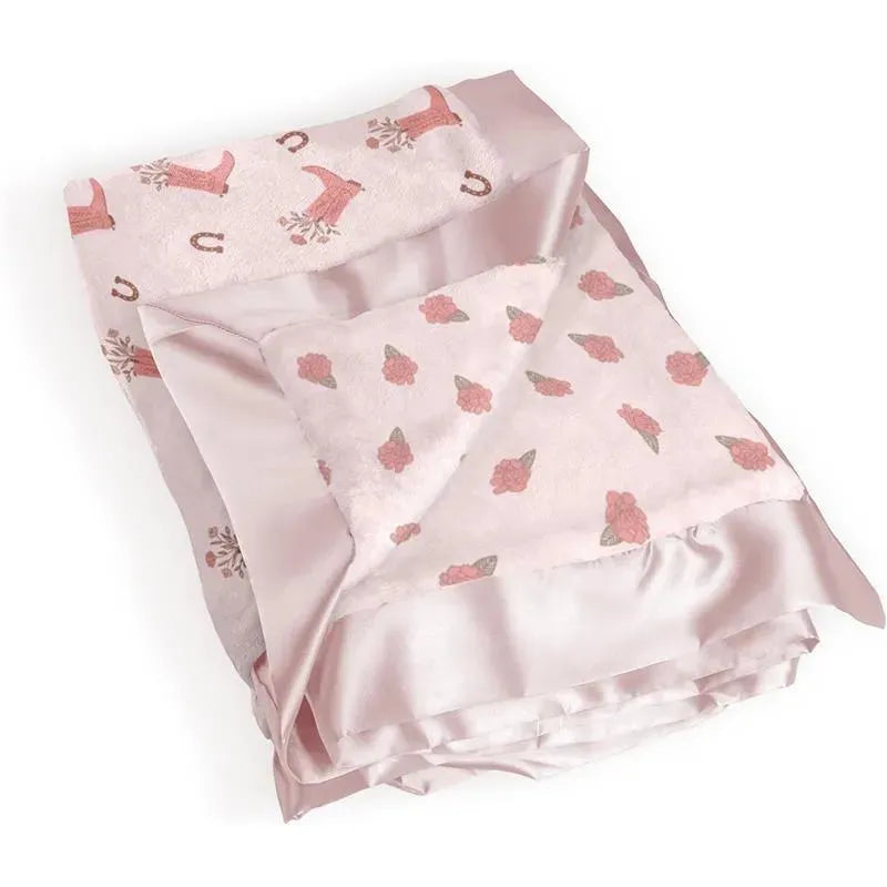 Reversible baby blanket from Jujube, featuring a pink floral design and soft satin trim.