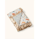Reversible baby blanket featuring colorful dinosaur patterns on one side and a soft gray spotted design on the other, trimmed in gold satin.