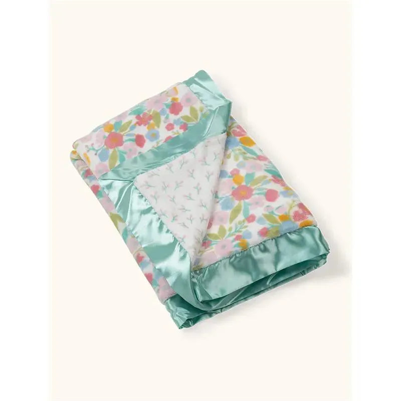 Reversible baby blanket featuring a floral design on one side and a soft, mint green satin border.